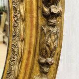 Large golden oval mirror