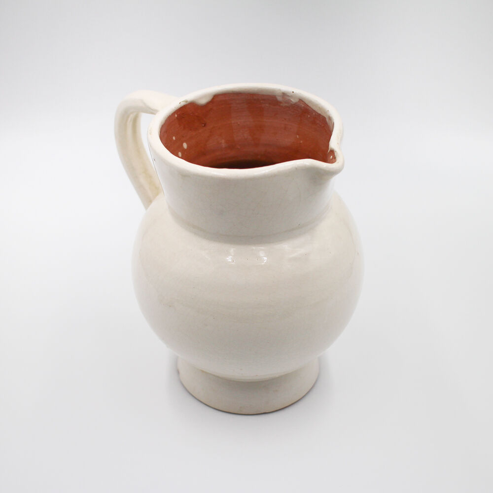 White pitcher in glazed stoneware