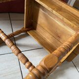 Small footrest bench in bohemian style.