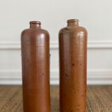 Duo of bottles in ancient sandstone