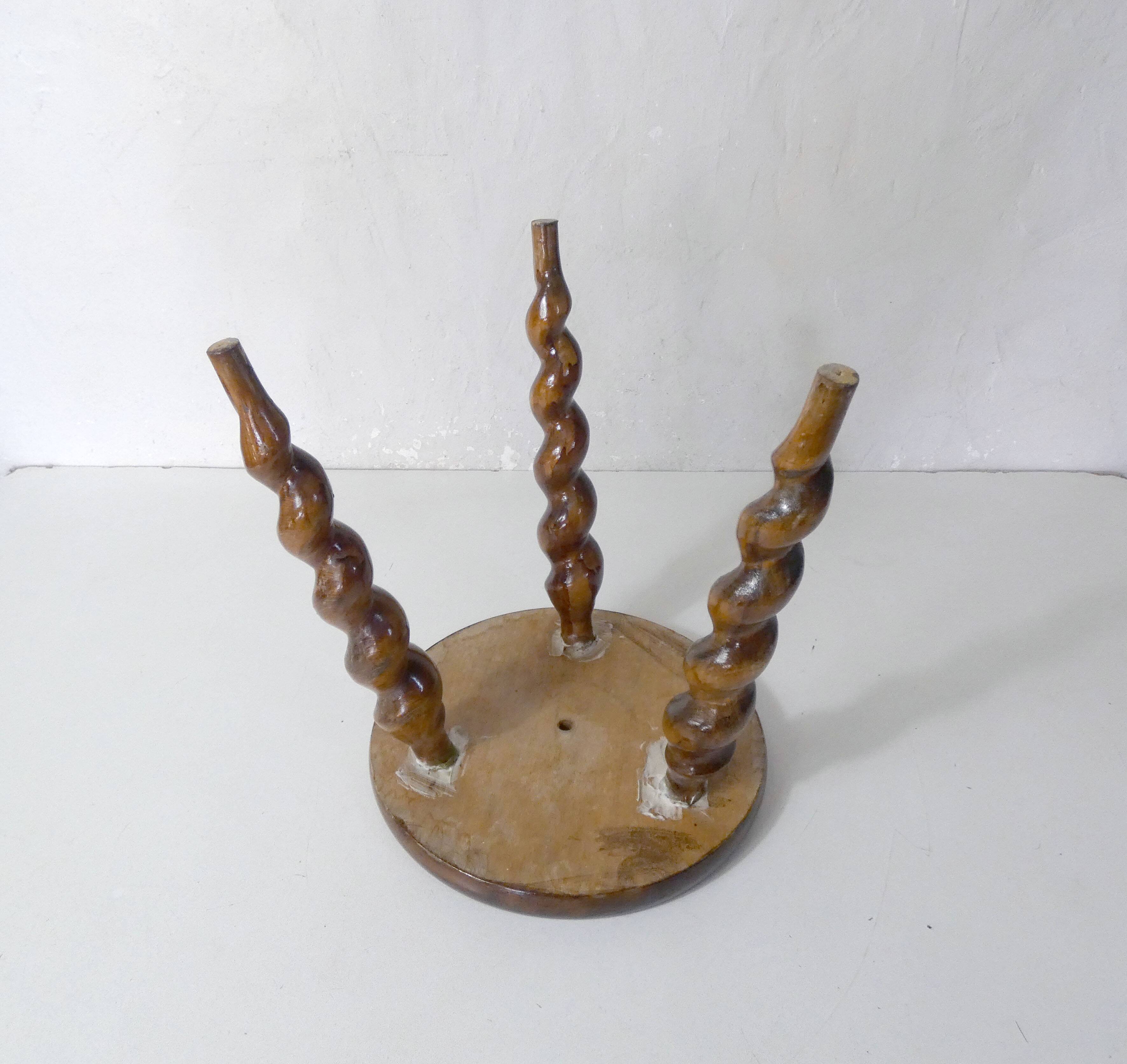 old tripod stool plant holder in turned wood