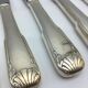 12 silver metal knives.