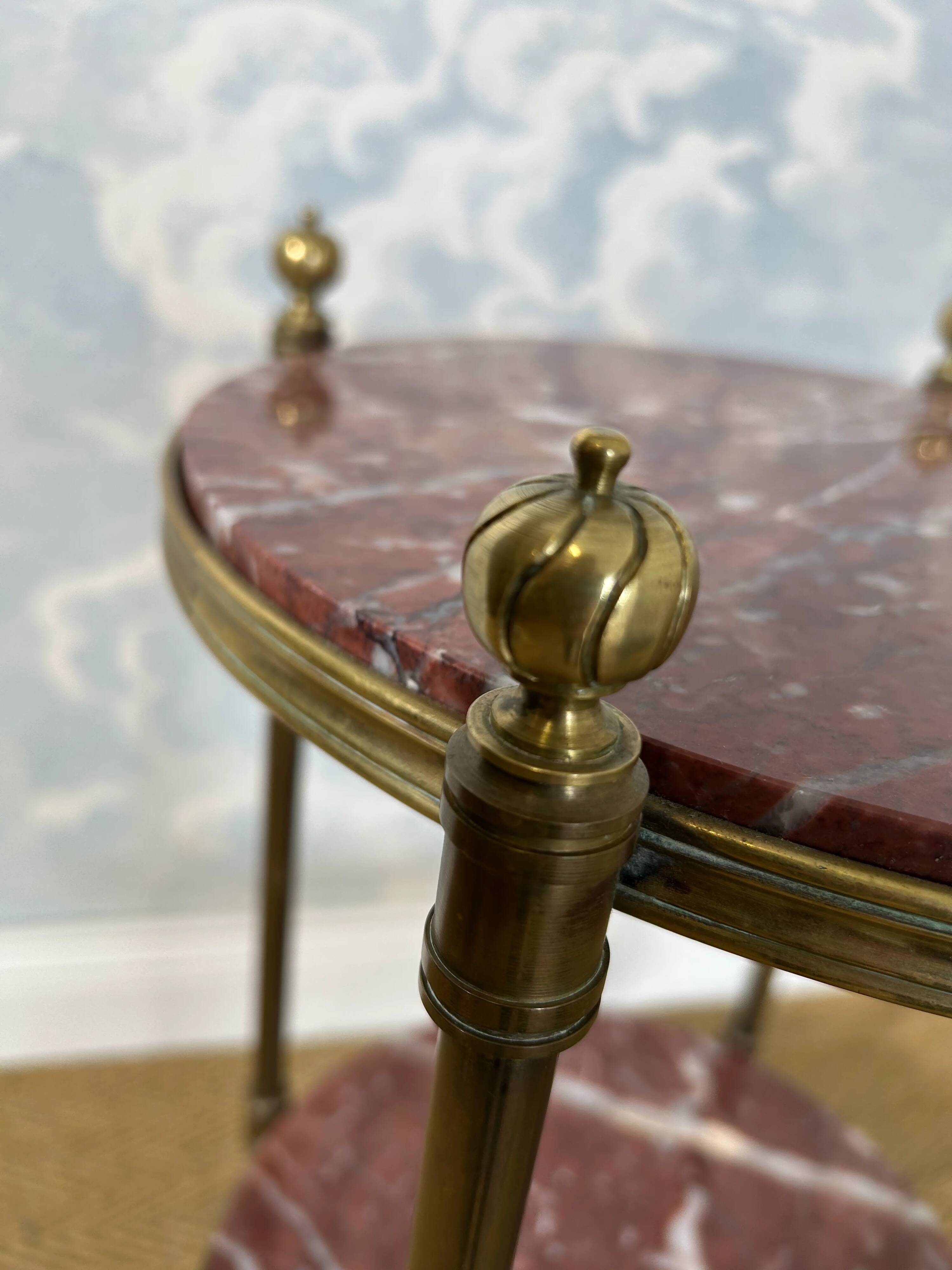 Two-tiered gueridon in Emperador marble on a brass structure, 1970s.