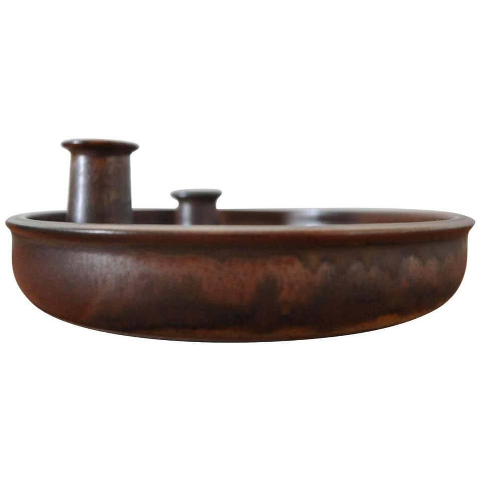 Candle holder made of stoneware with a harefur glaze