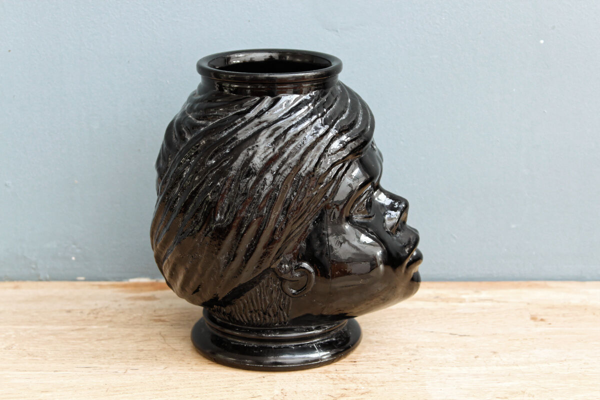 Molded glass vase, nubian's head