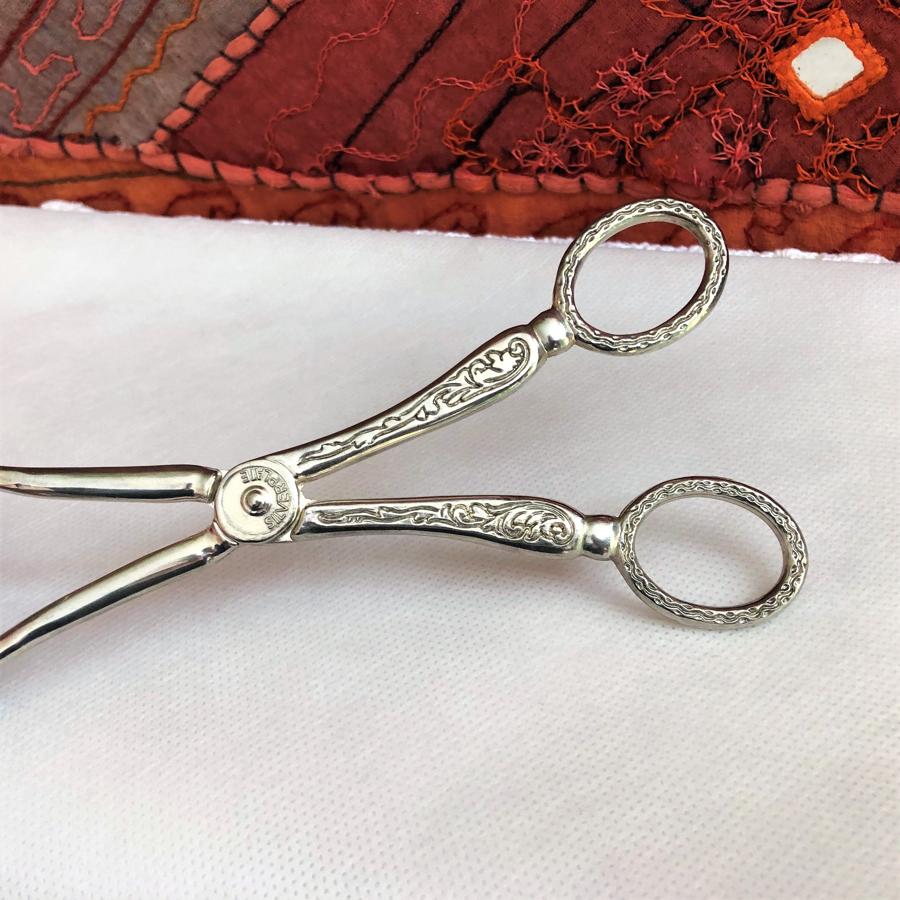 Wrought silver plated cake clips