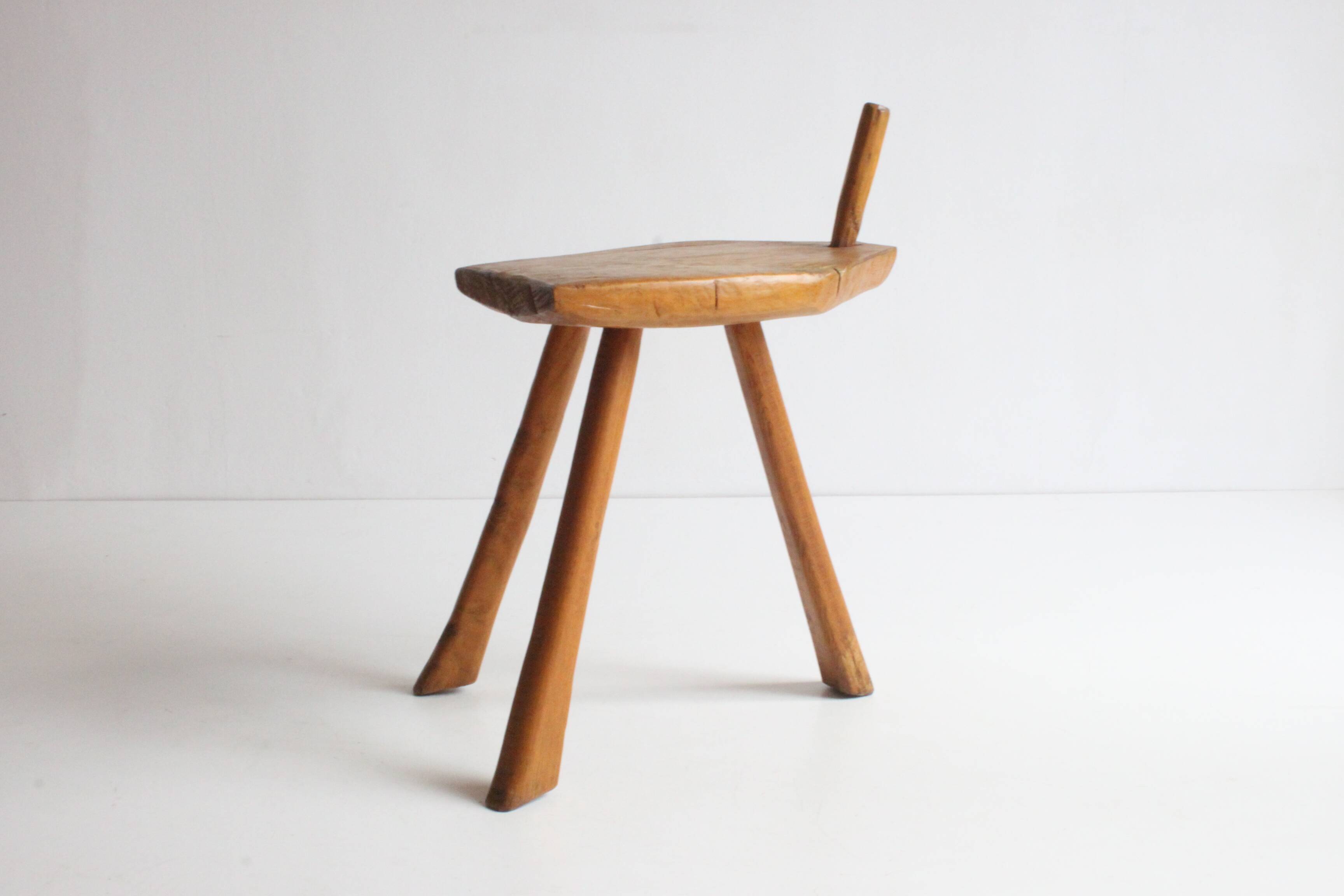 Brutalist tripod stool in carved wood, 1950s