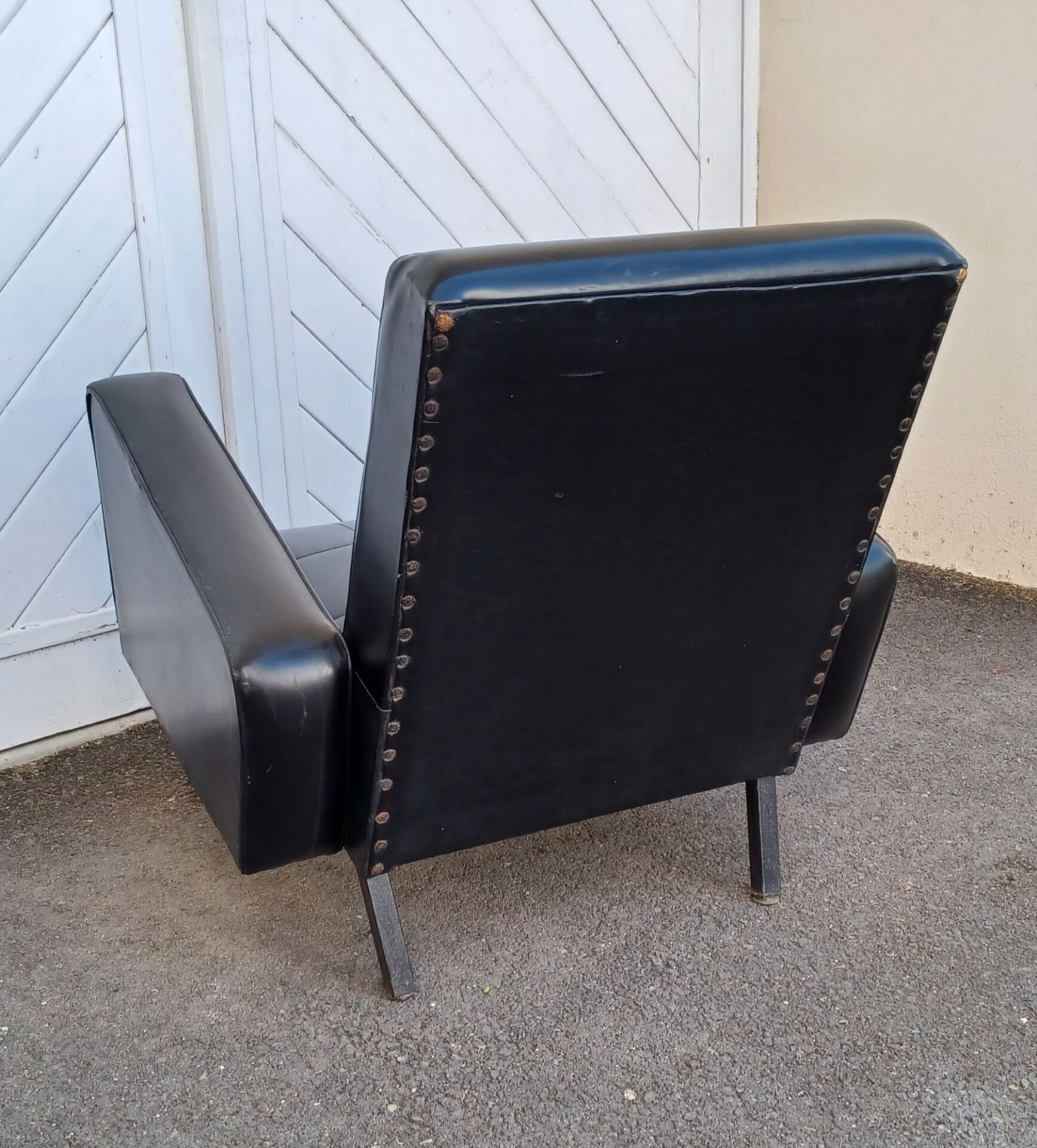 Black faux leather armchair from the 1960s