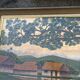 Large naive oil painting signed Medrano: rice field and buffalo, village with roofs of