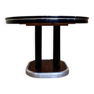 Table ronde a allonge acajou et bois laqué époque art deco