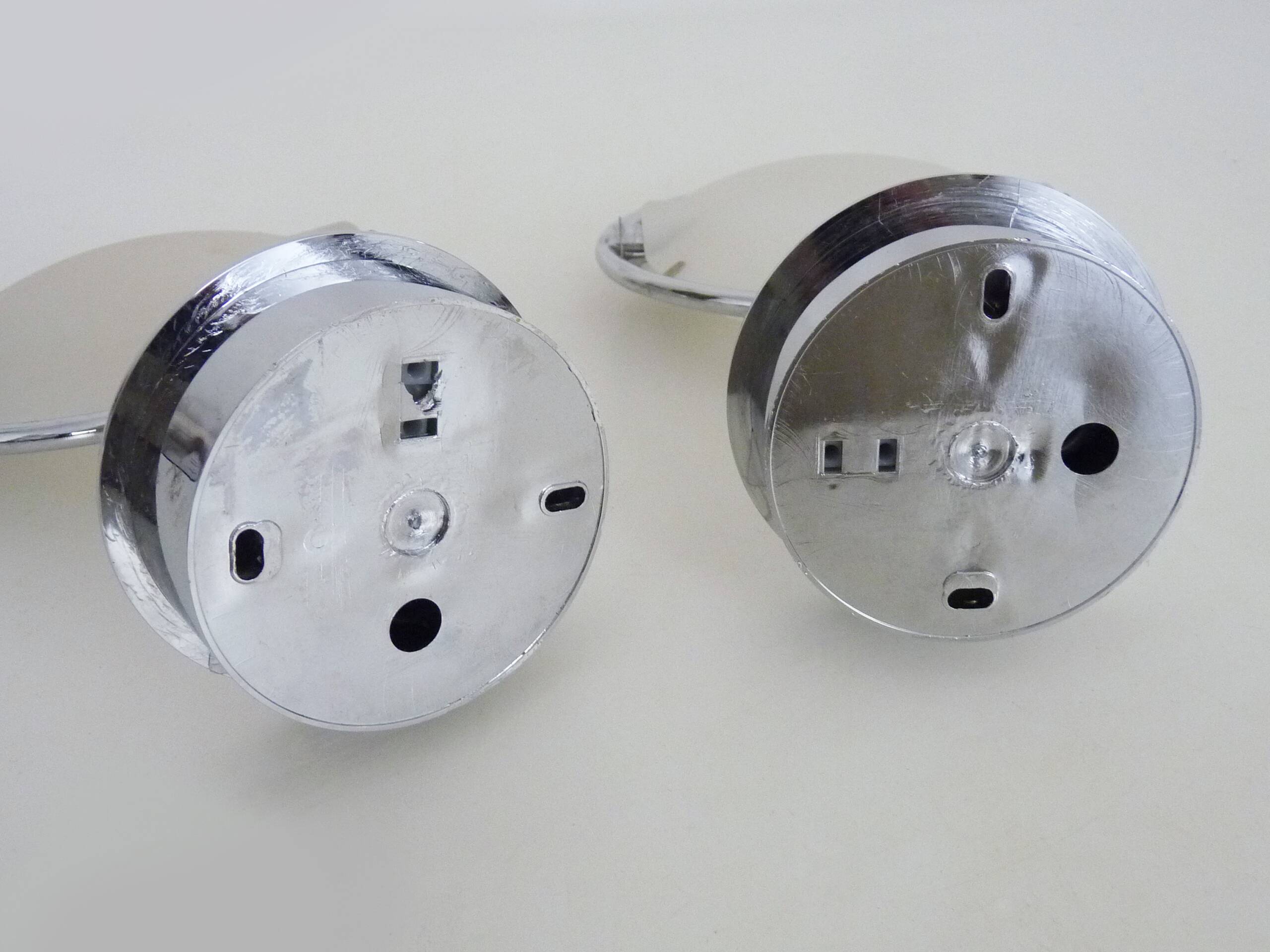 Pair of Italian Fontana Arte Nobi wall lights in chrome metal and satin glass.