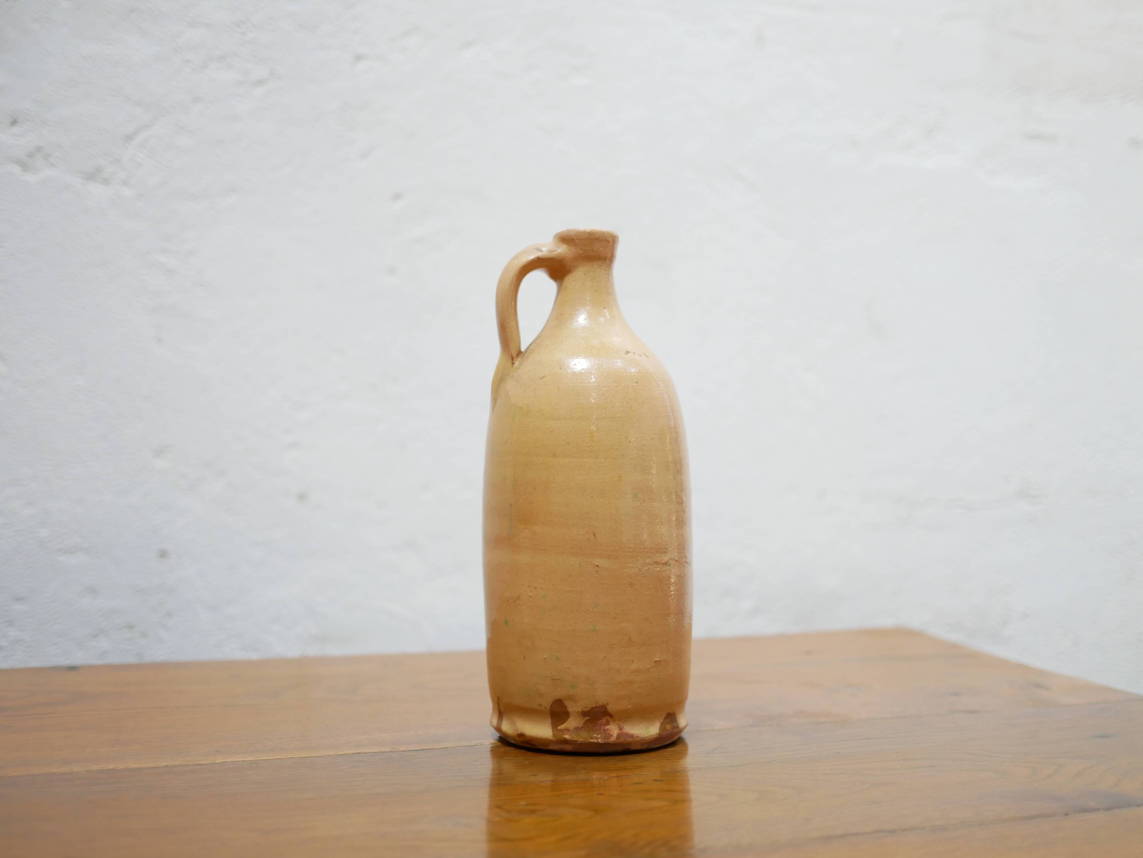 Vintage glazed terracotta bottle