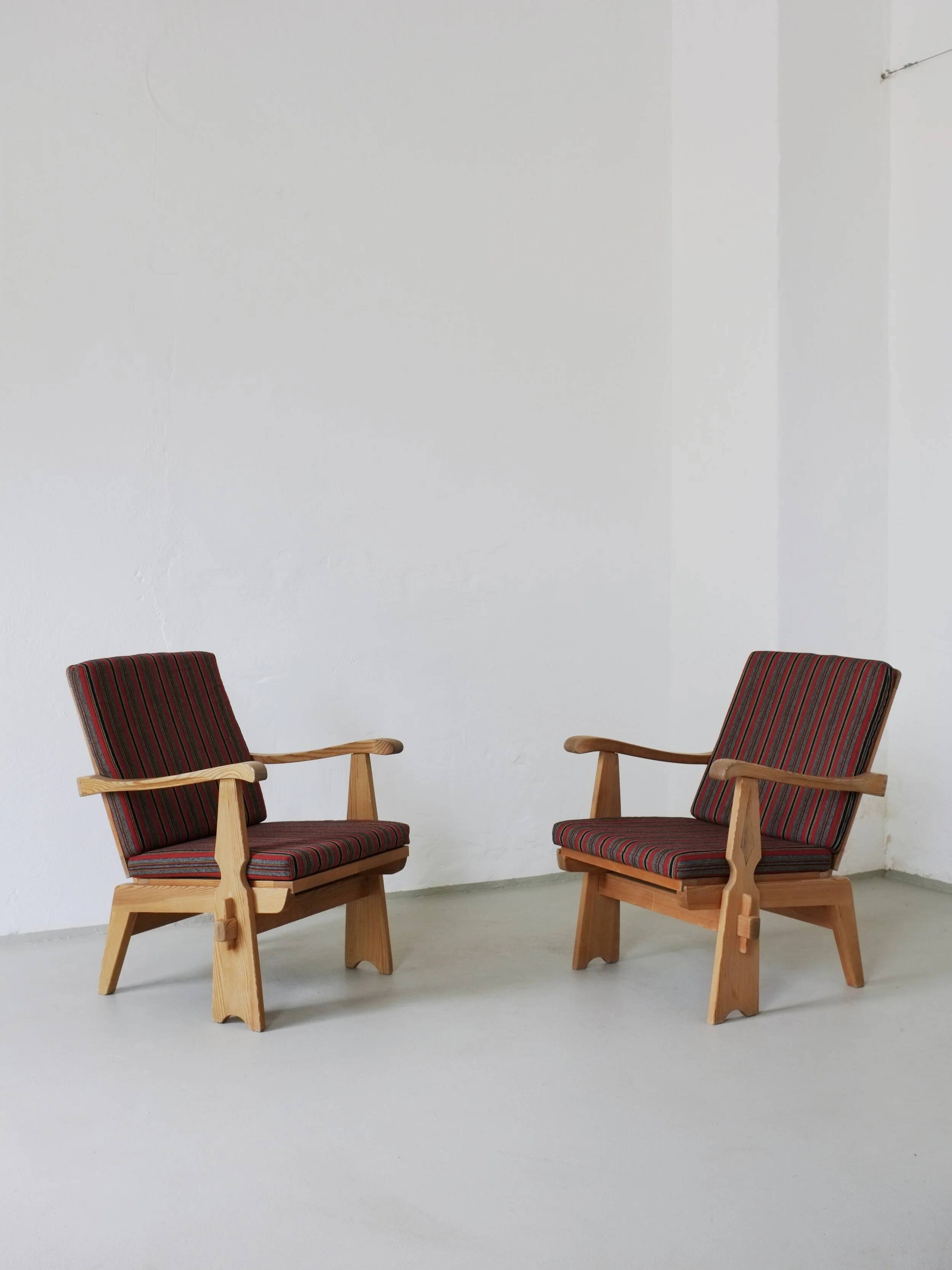 2 carved pine lounge chairs | Scandinavia | 1970s