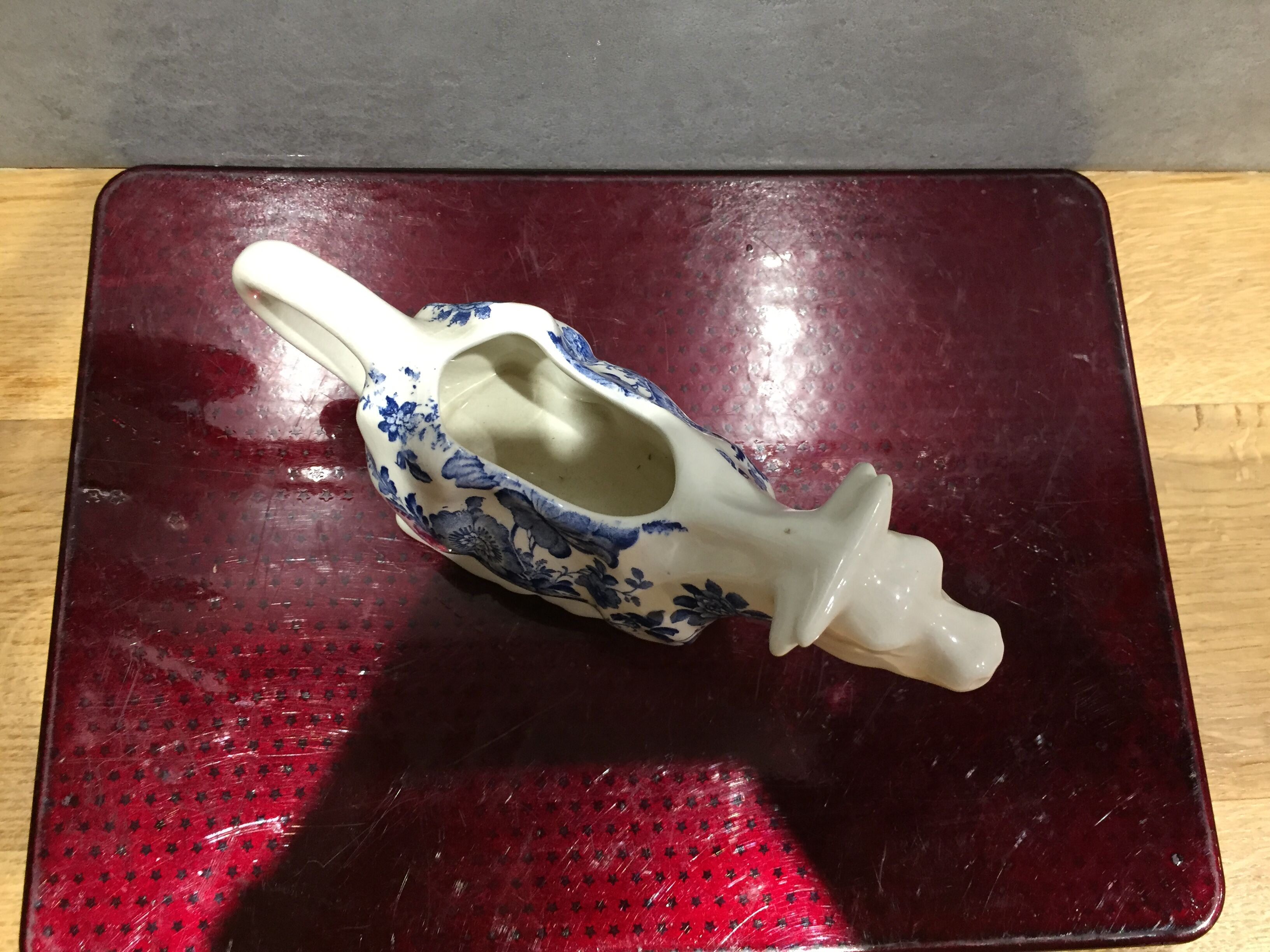English porcelain cow-shaped sauce dish