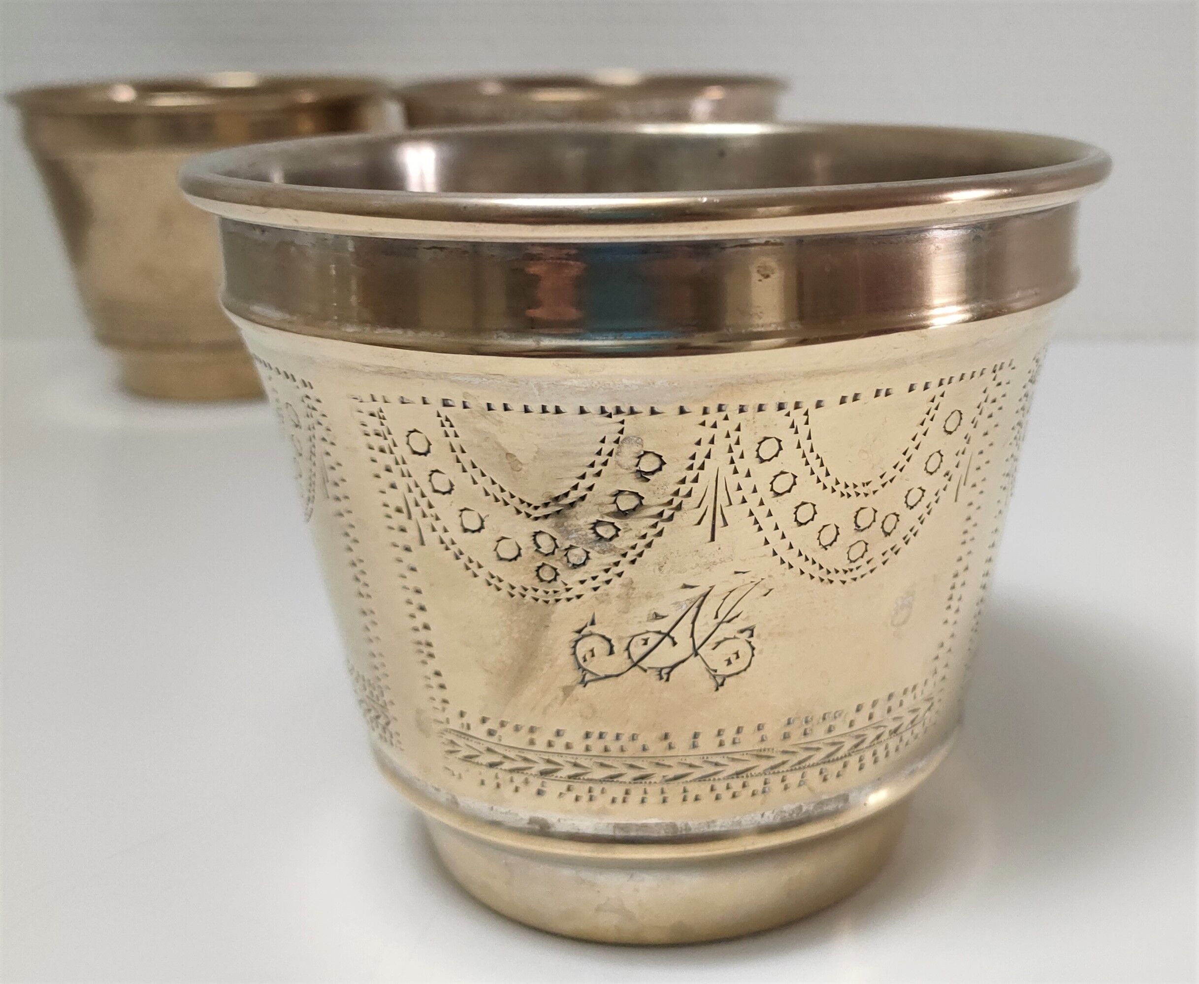 Three pot covers brass silver cover golden patina monogram early twentieth century