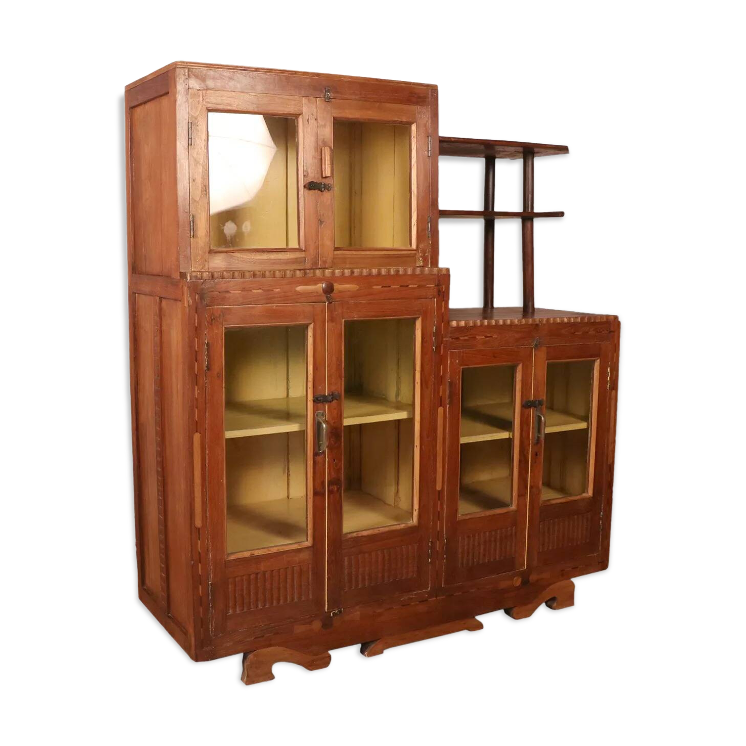 Antique Art Deco display cabinet in Burmese teak with original yellow patina interior.
