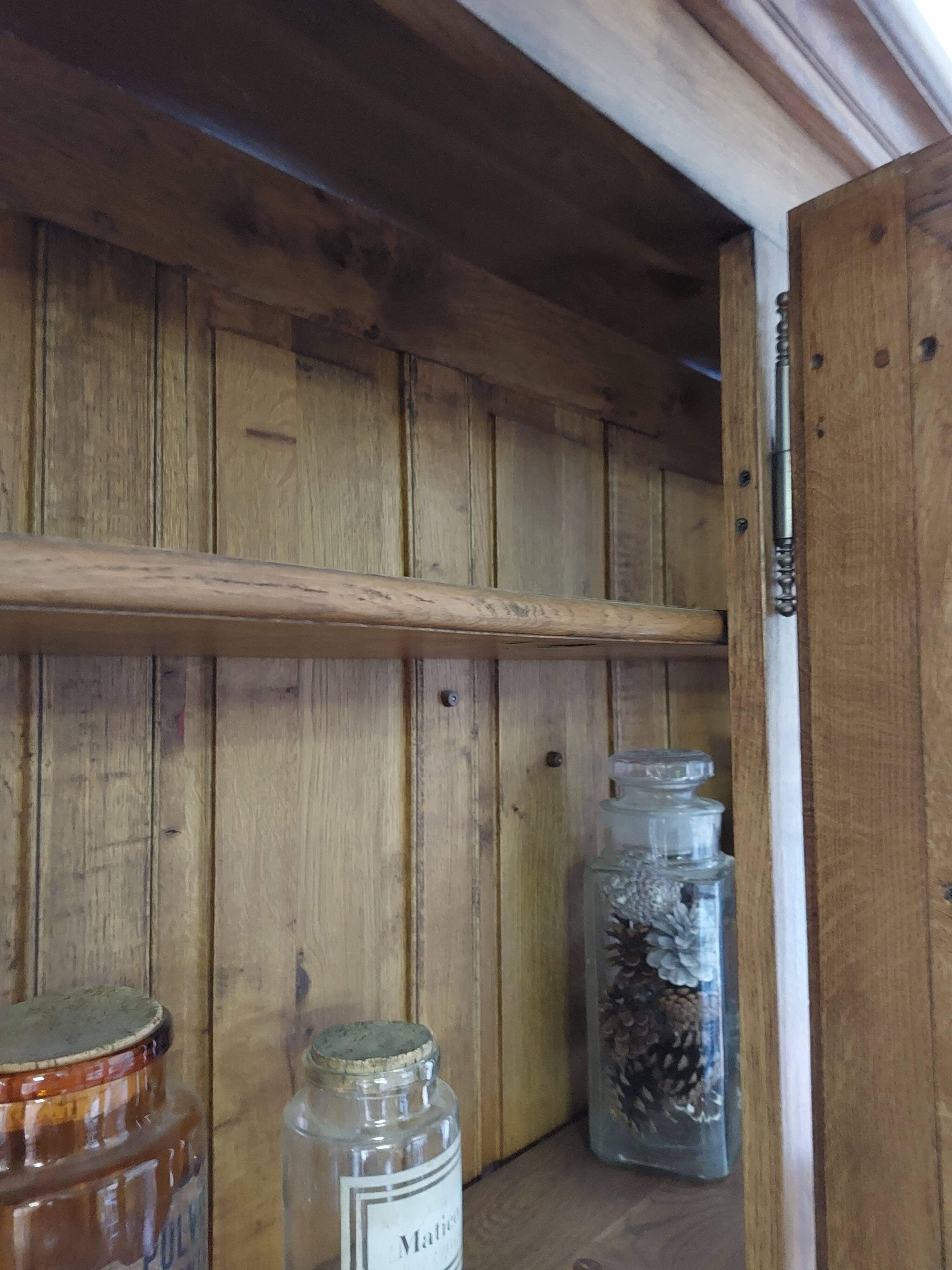 Showcase library with two sections in solid oak.