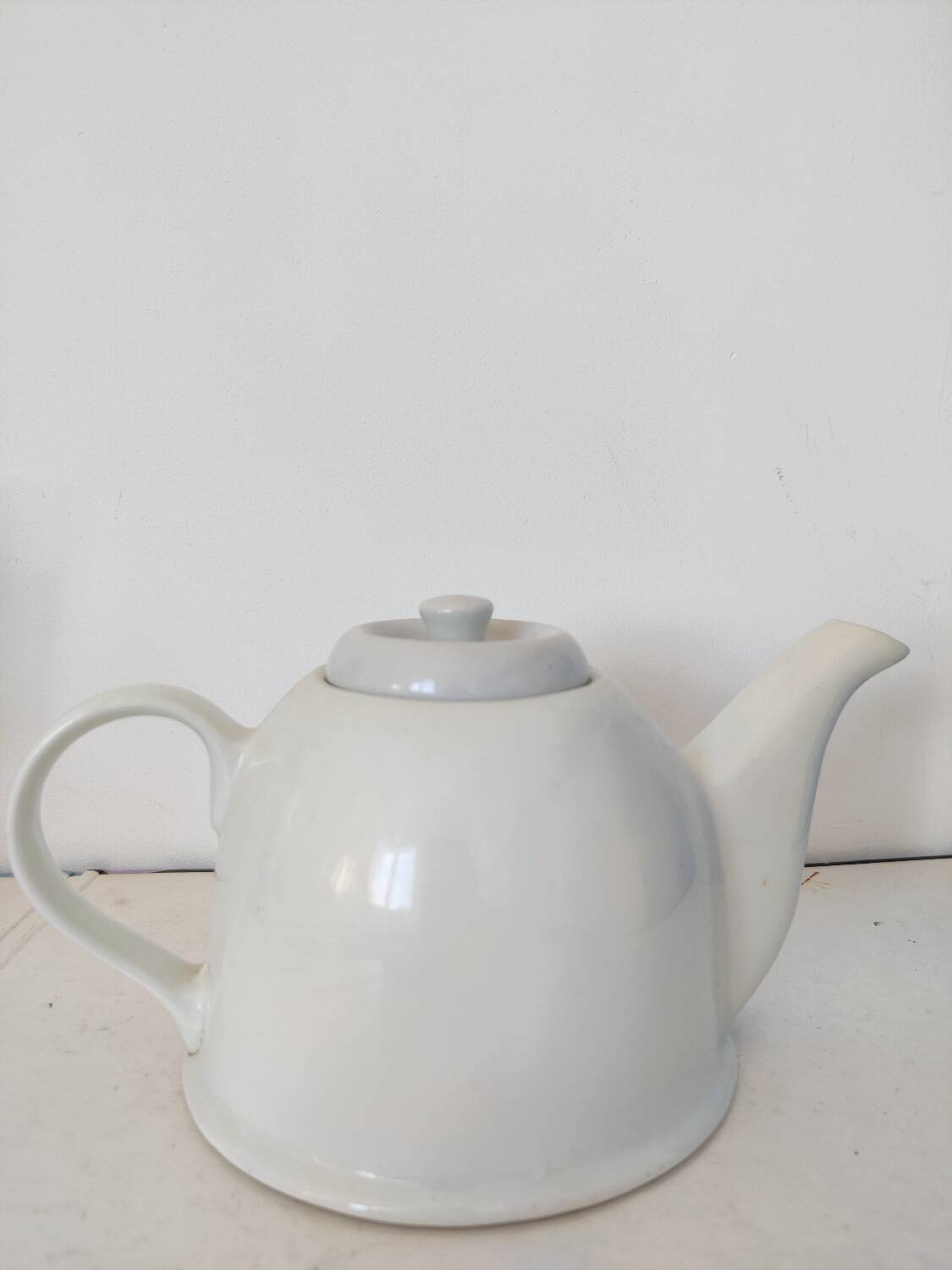 Small white porcelain teapot