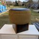 Black hexagonal pouf in fabric and faux leather, mid-century Hungarian ottoman from the 1950s.