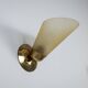 Set of three brass sconces with decorated yellow glass shades