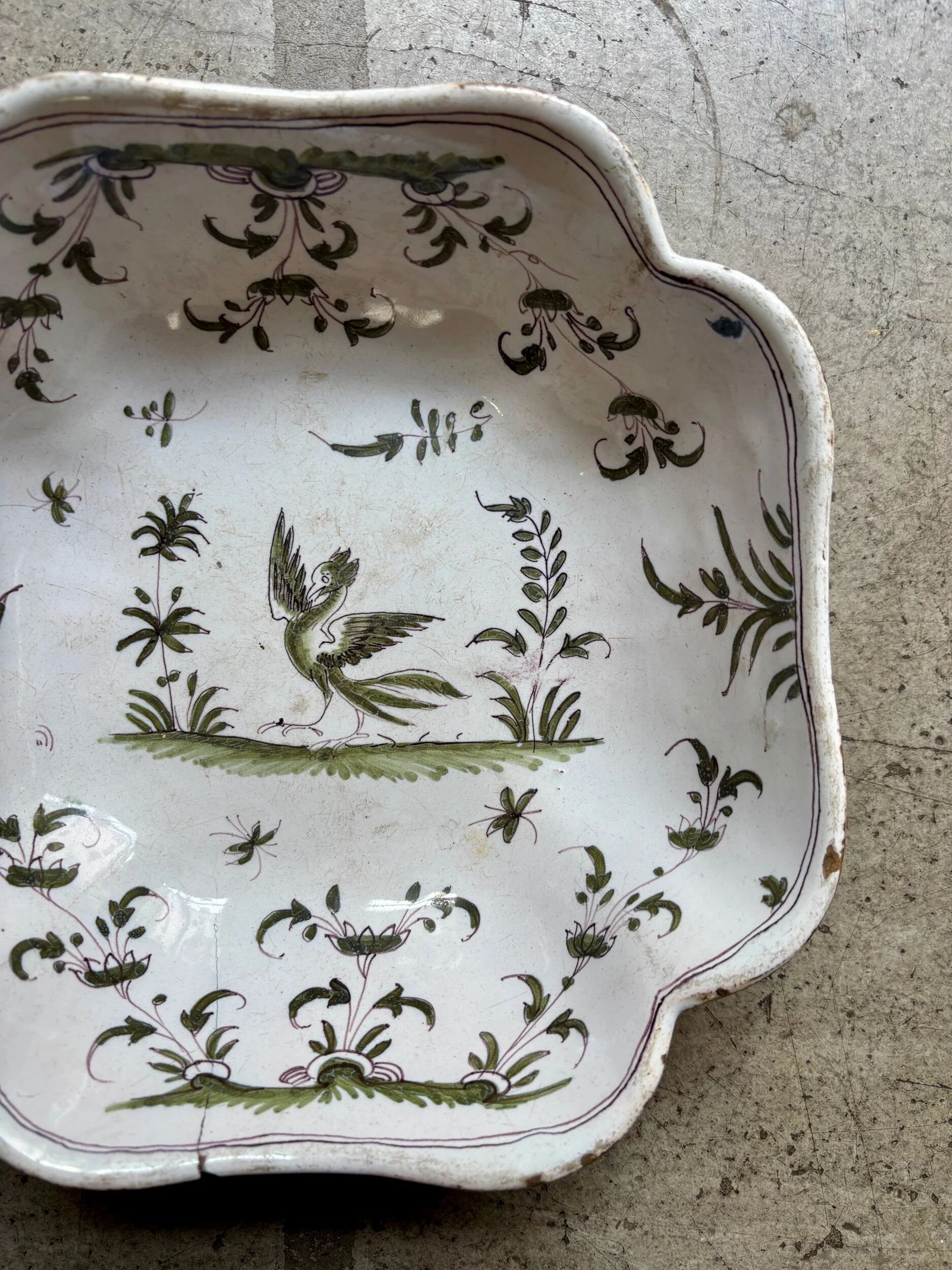 Moustiers salad bowl in cream and green earthenware, 18th century.