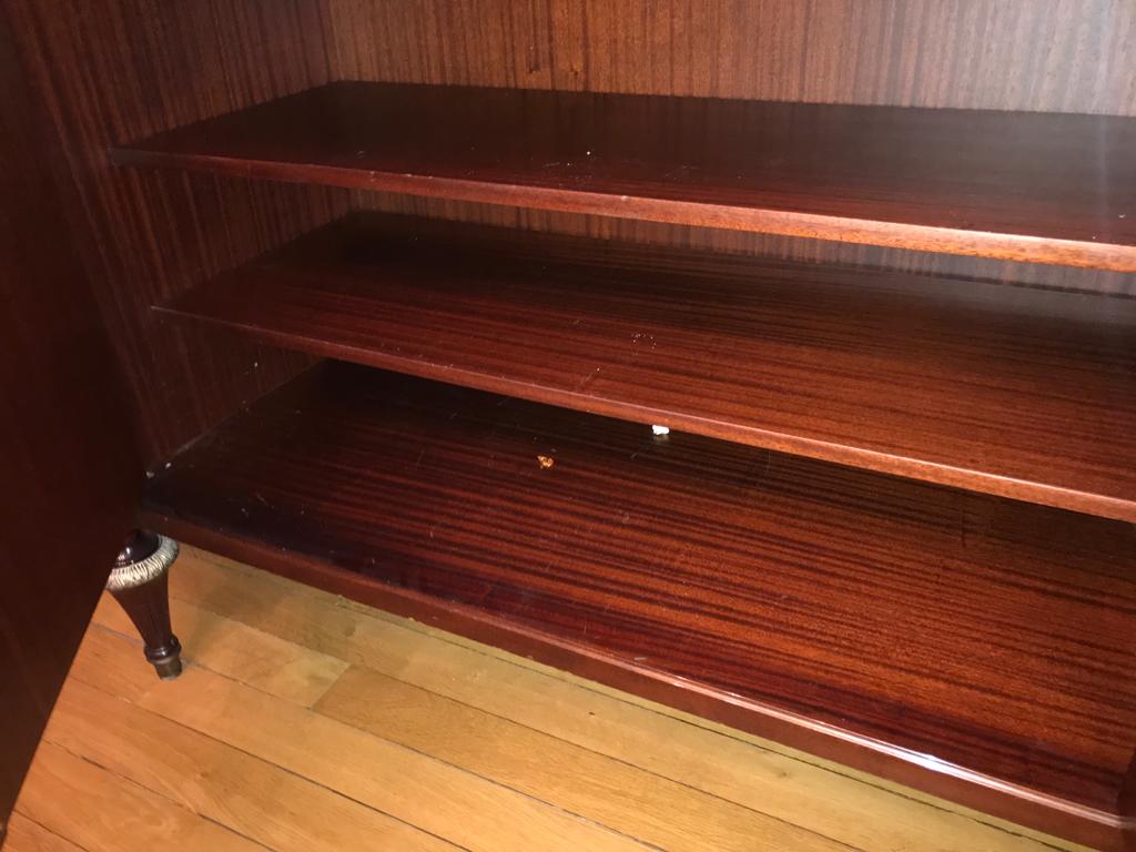 A mahogany buffet varnished with marble and bronze