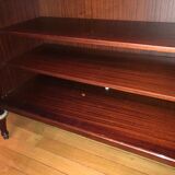 A mahogany buffet varnished with marble and bronze