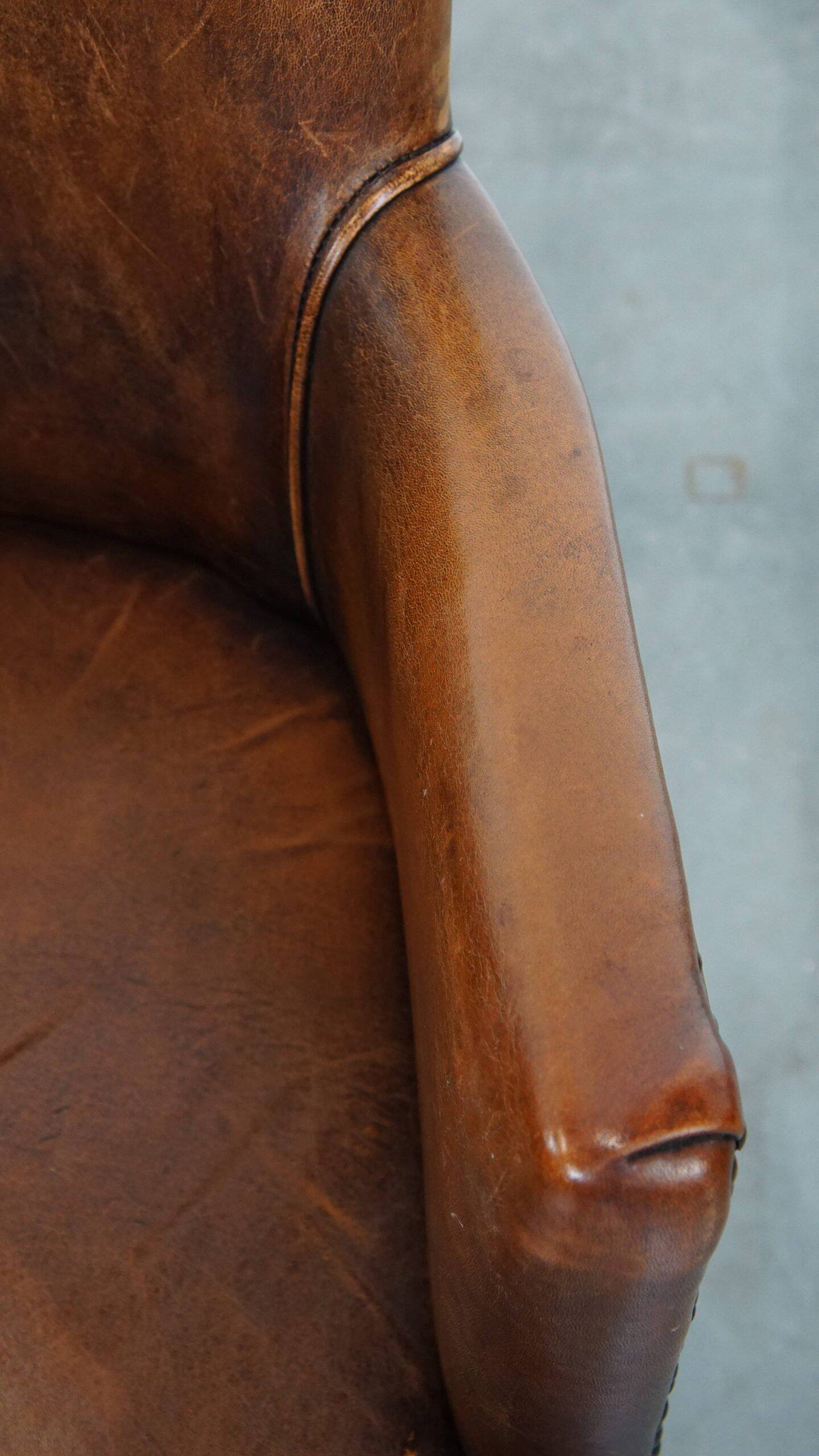 Amazing cognac-coloured sheepskin dining/side chair with armrests