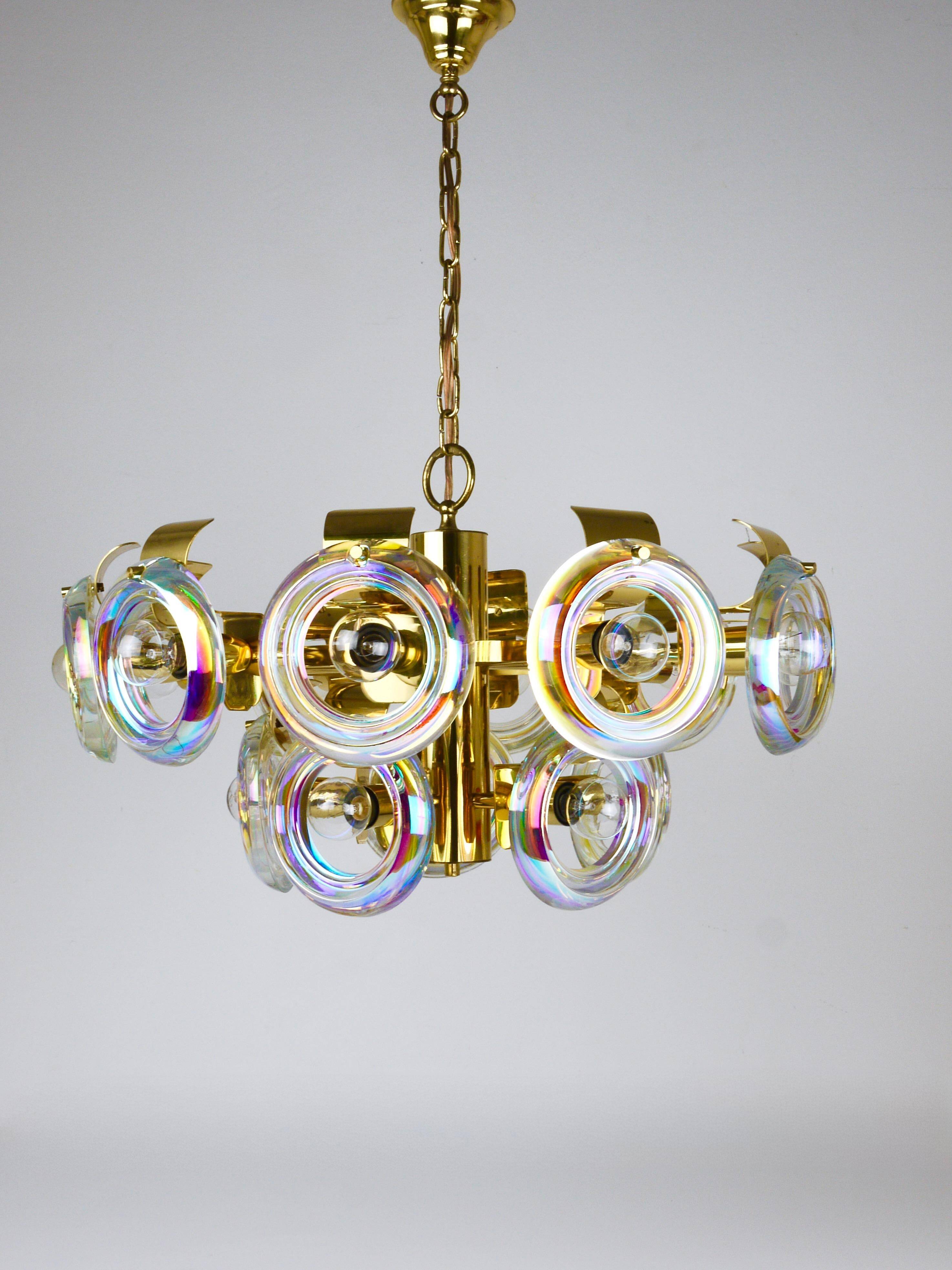 Large brass chandelier by Oscar Torlasco, rainbow optical glass rings, Italy, 1970s.