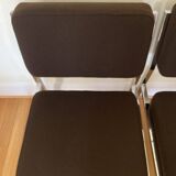 Pair of brown low chairs with chrome base