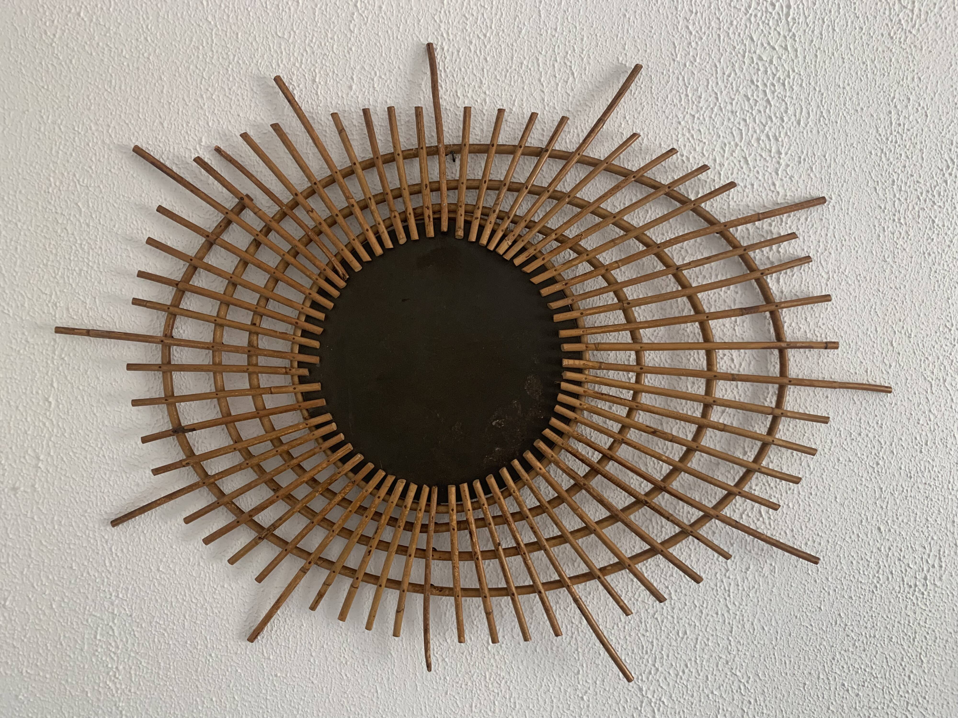 Vintage 1960s sunburst rattan ortf style spiral eye mirror - 90 x 67 cm