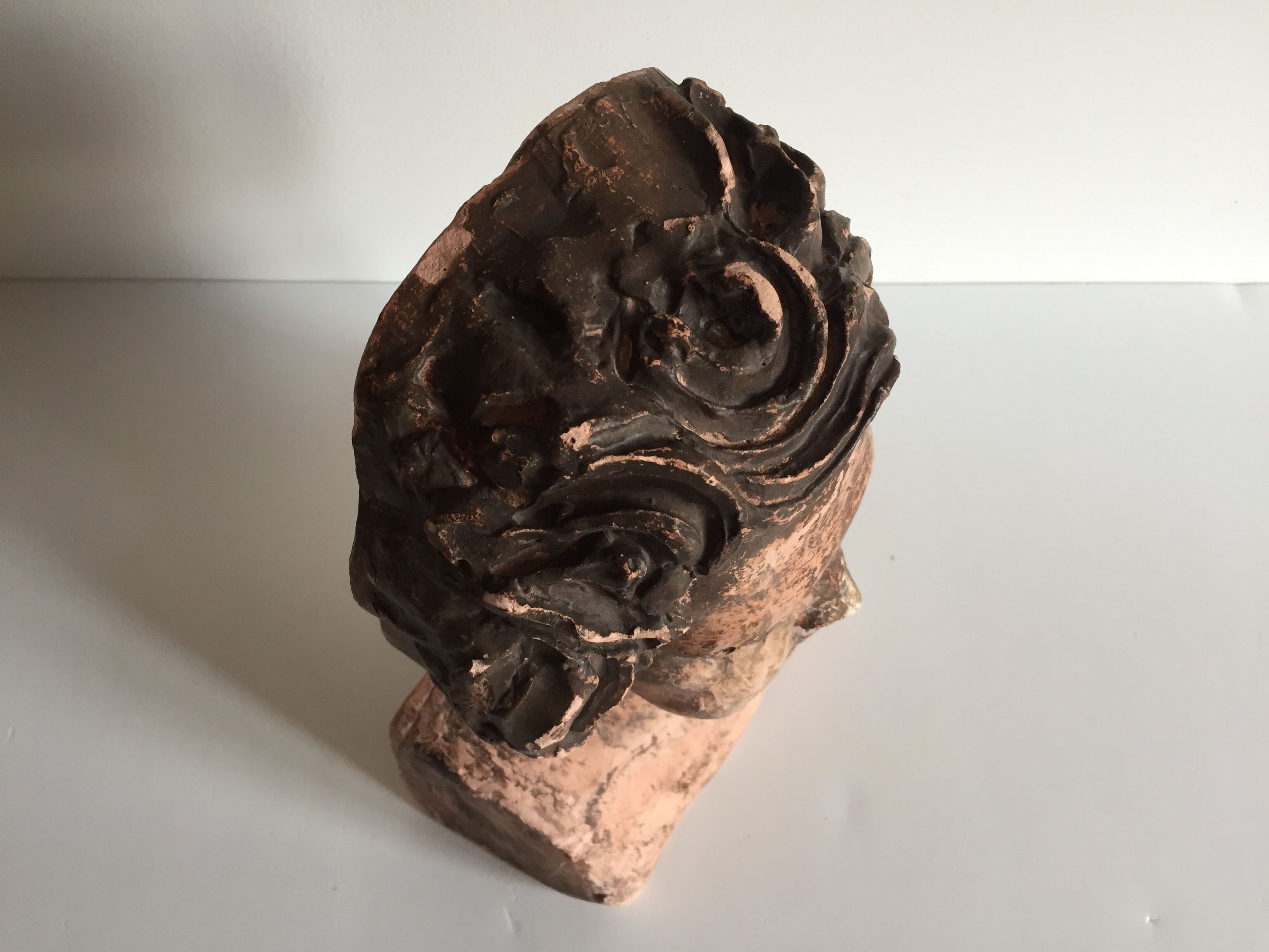 Bust old child in plaster stamped l.j.c.