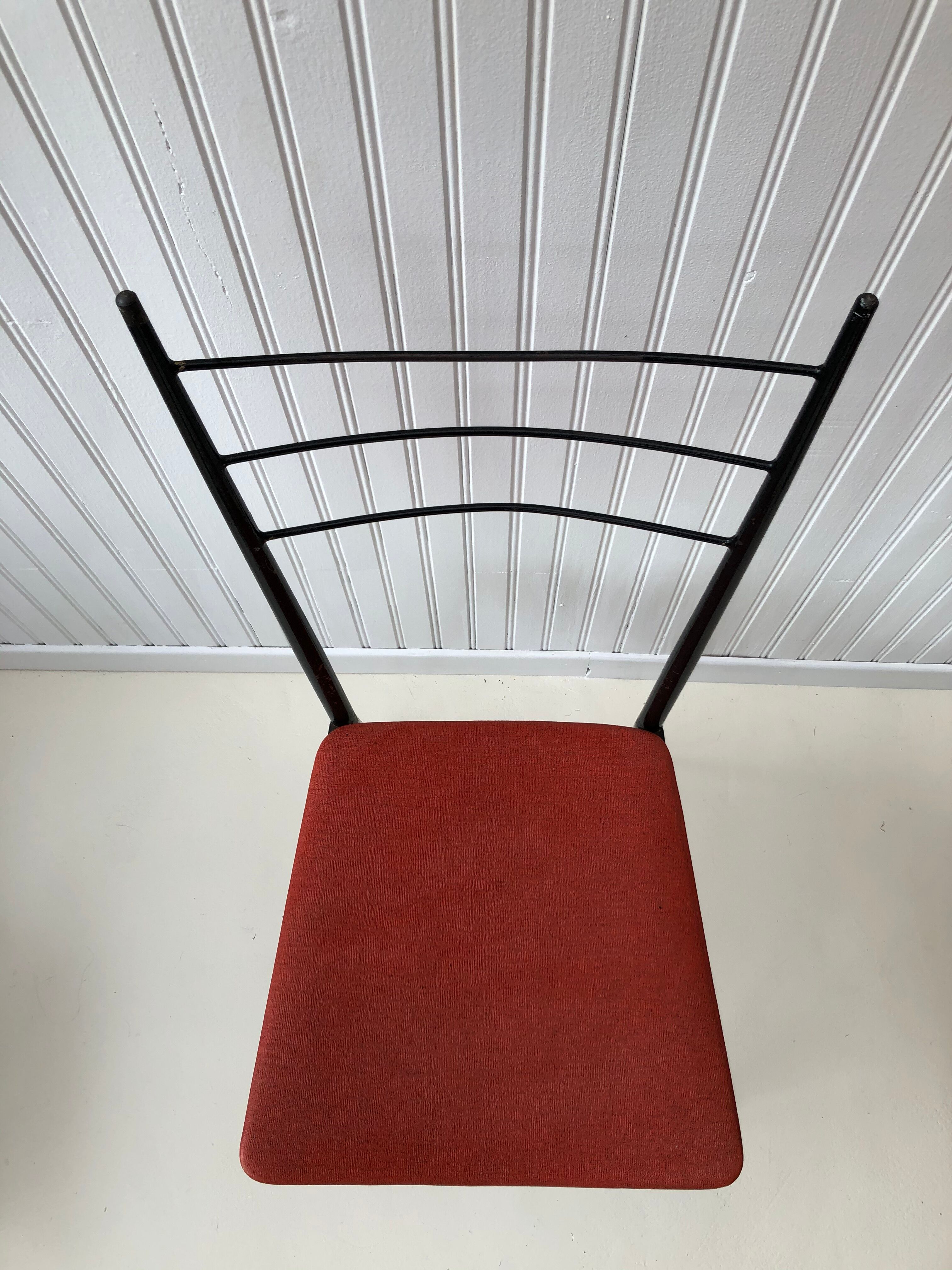 Red metal chairs from the 60s