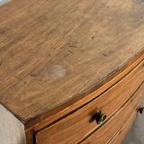 English commode from the George III Regency period, bombe shape in mahogany veneer.