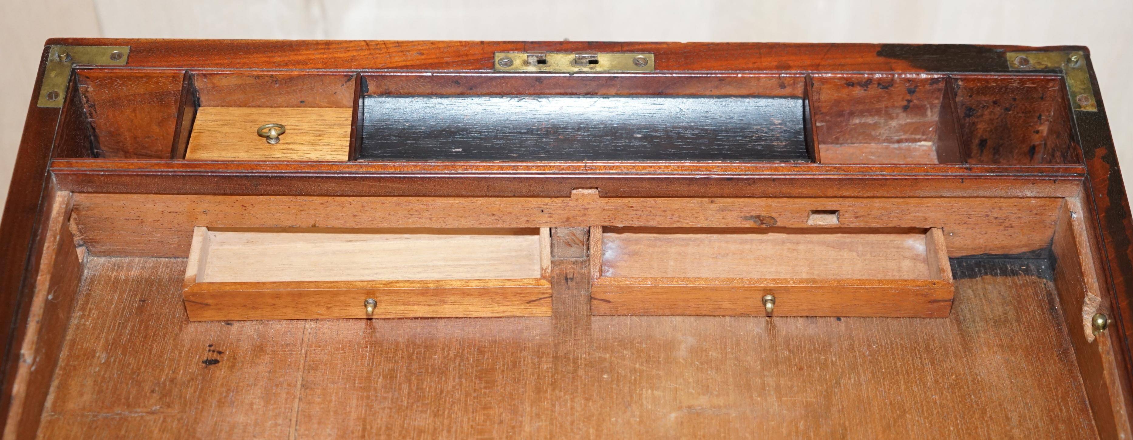 Antique hardwood military campaign desk with writing slope.