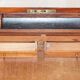 Antique hardwood military campaign desk with writing slope.