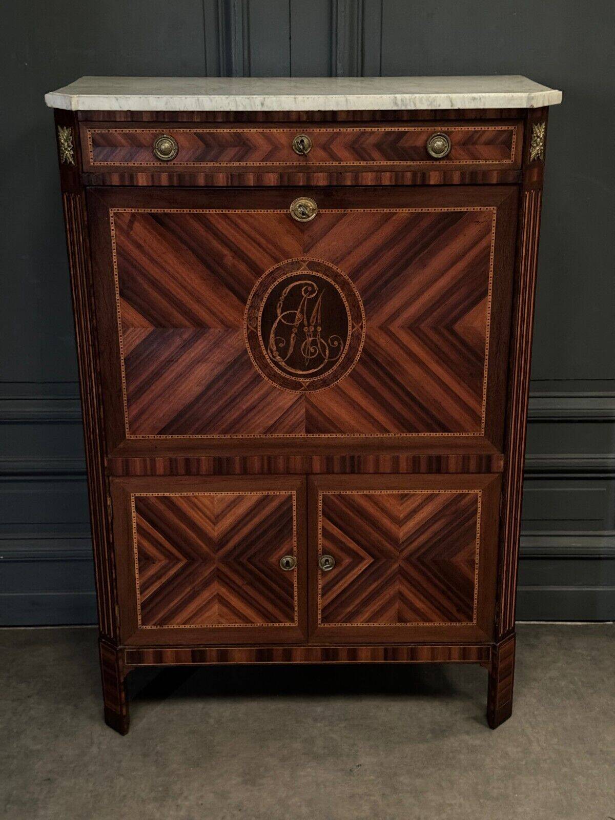Louis XVI period secretary in monogram marquetry and white marble