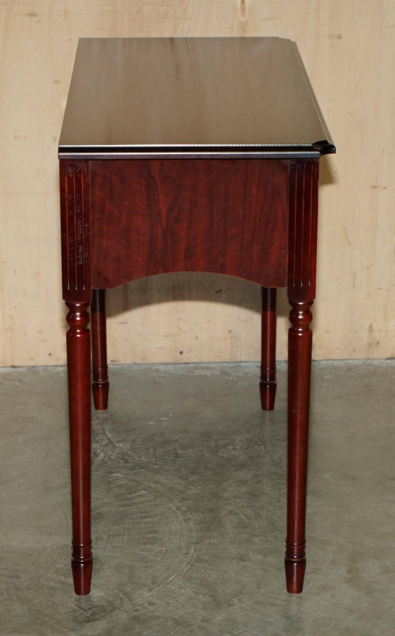 Small console with two drawers in hardwood finish.