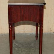 Small console with two drawers in hardwood finish.