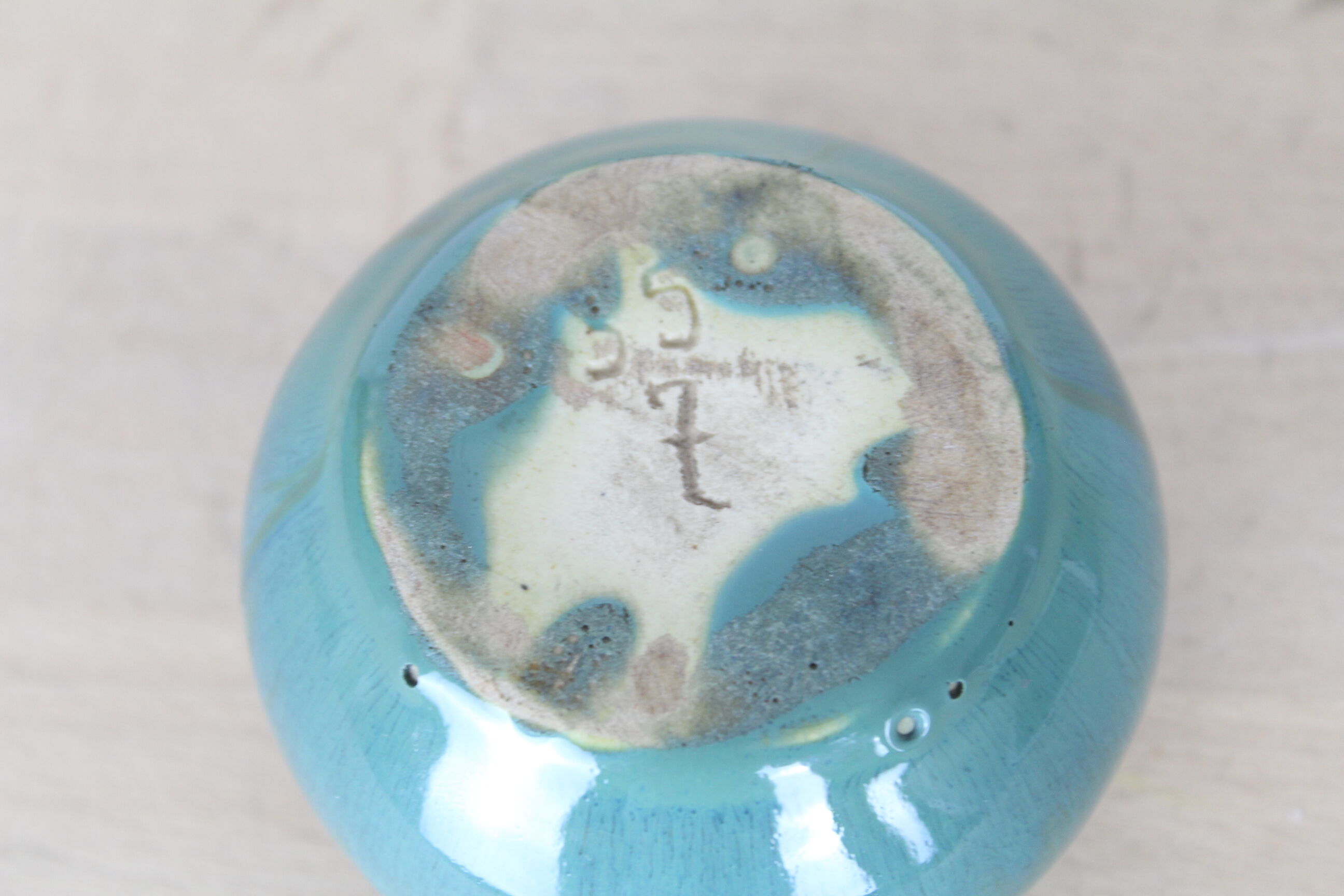 Ball vase with blue drippings