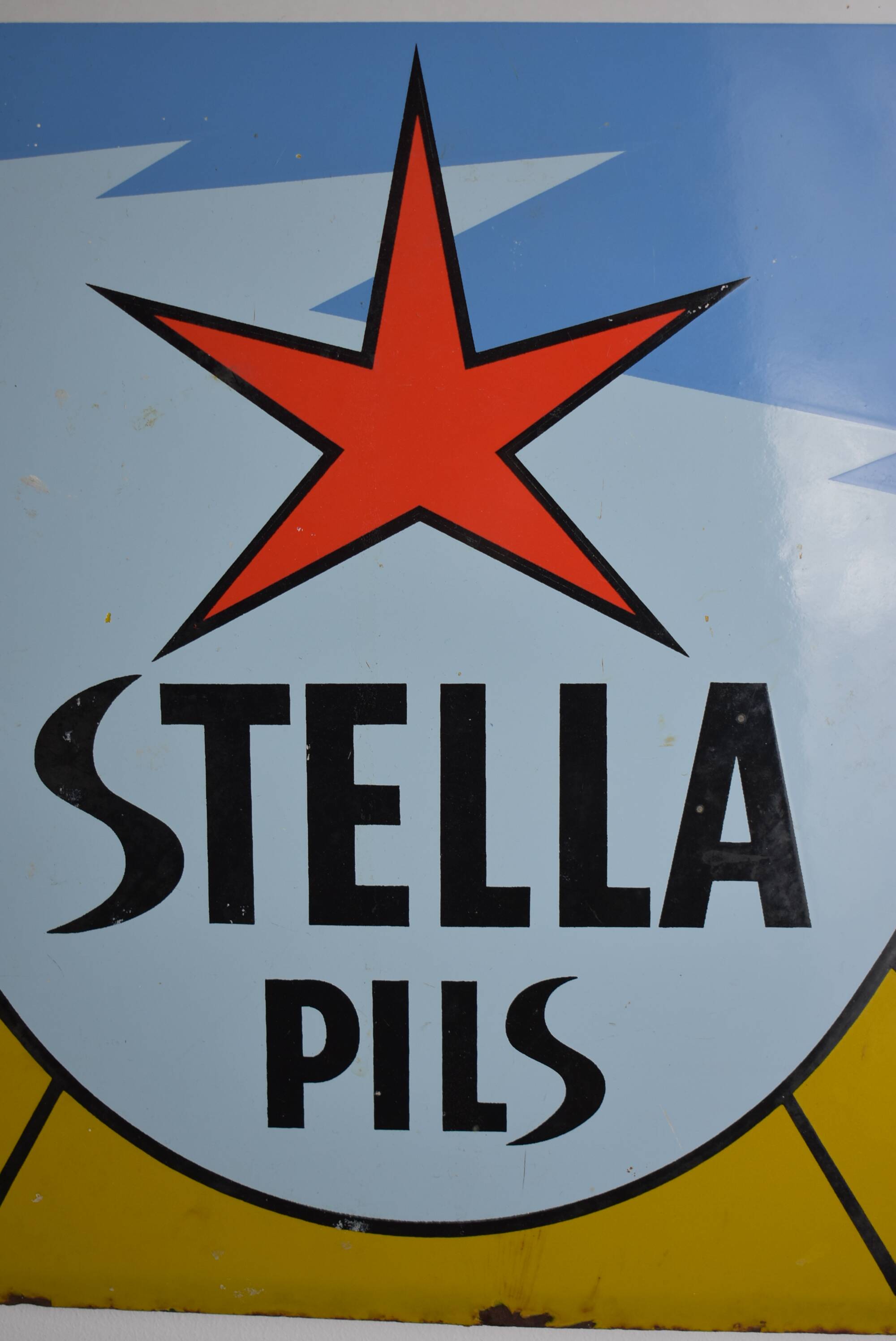 Stella Pils beer enamelled plate