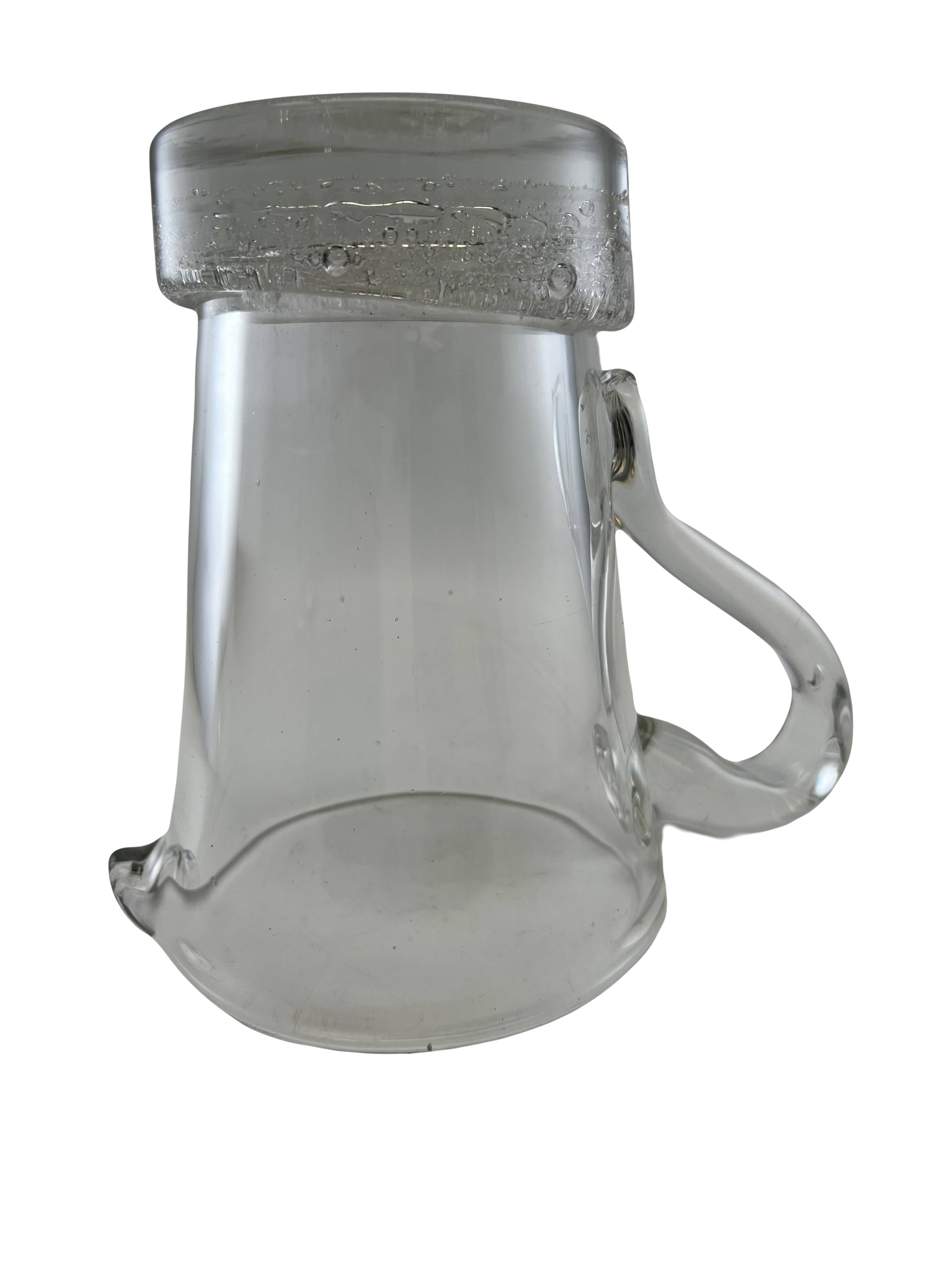 Large stylized glass pitcher