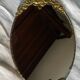 Antique bronze oval mirror
