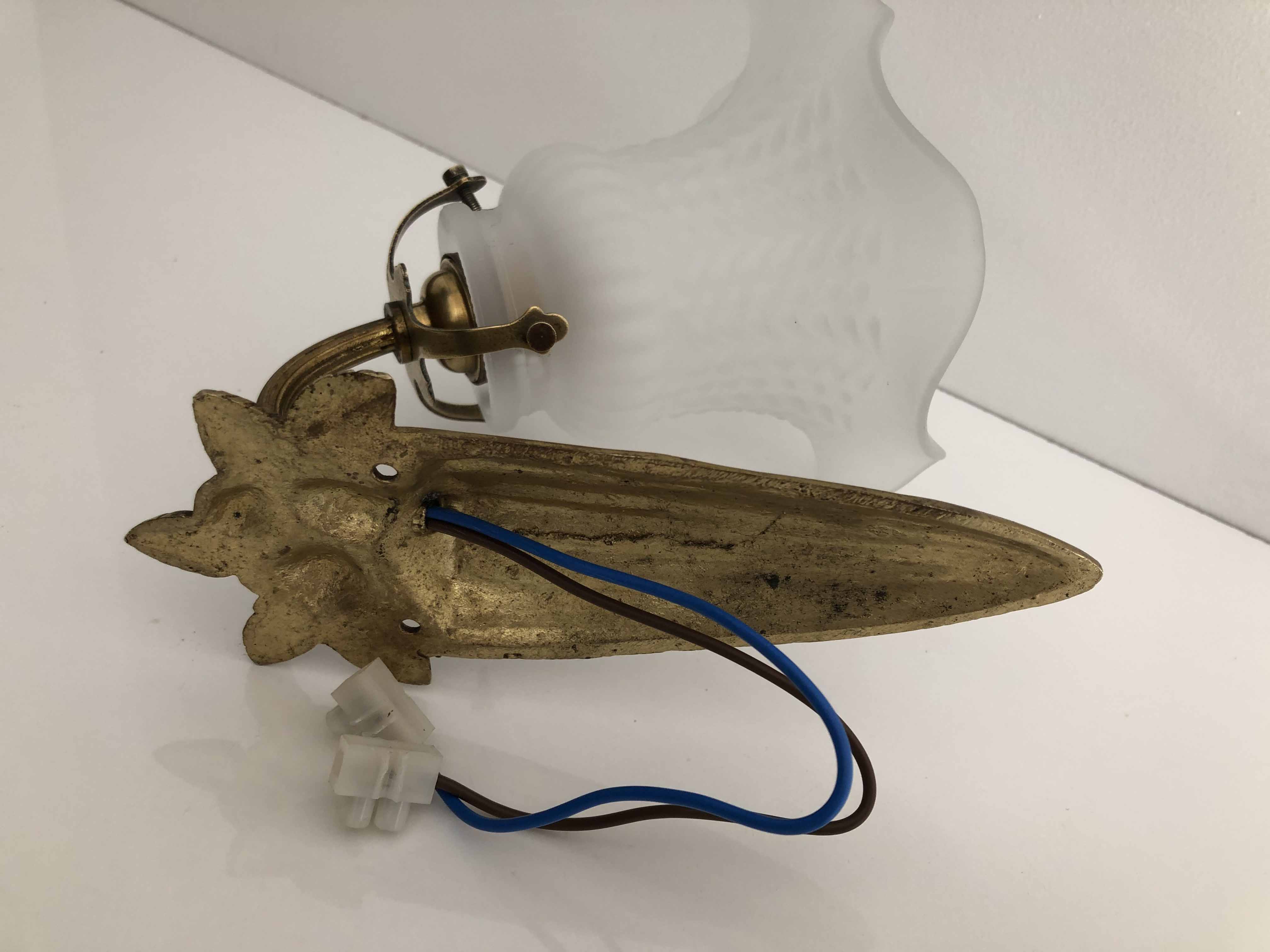 Ancient bronze and opalescent glass sconce