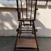 Wooden baby high chair convertible into a small desk from the 1950s