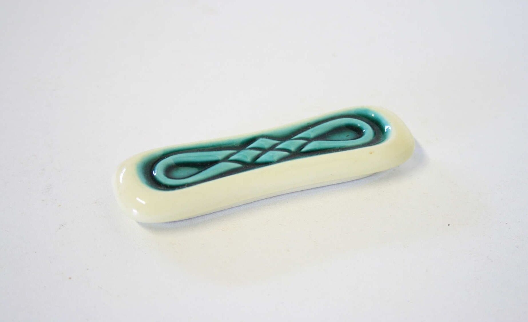 Set of twelve turquoise ceramic knife holders