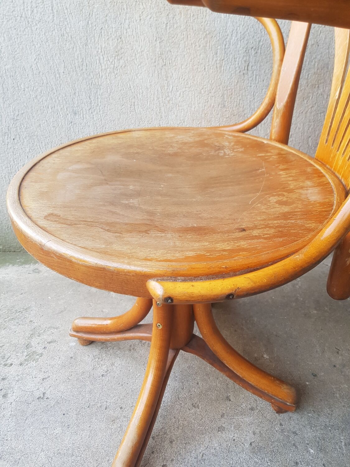 Swivel wooden armchair