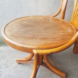 Swivel wooden armchair