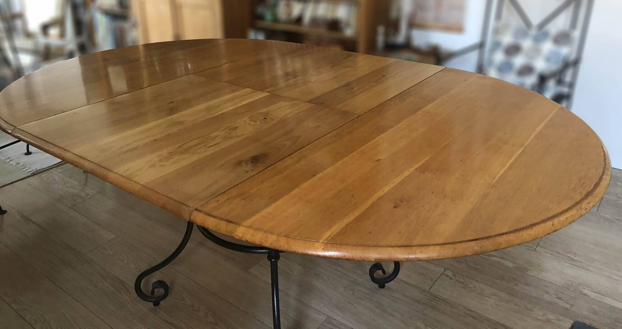 Extendable table in solid oak with wrought iron legs.