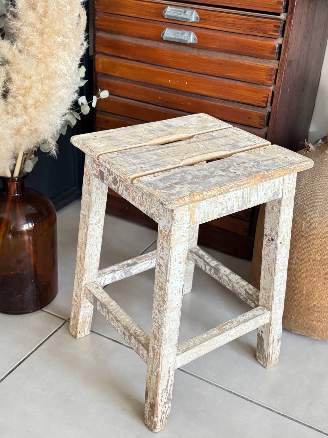 Old wooden stool with square seat